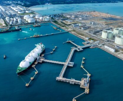 Energy Estimating - LNG (Liquified Natural Gas) tanker anchored in Gas terminal gas tanks for storage. Oil Crude Gas